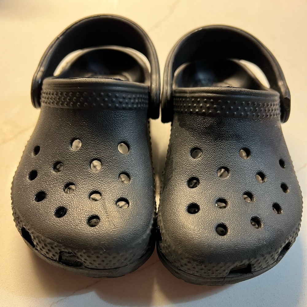 Toddler size 6 crocs in black.